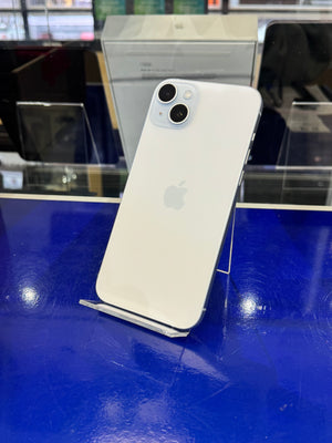 White smartphone on a stand against a blue background