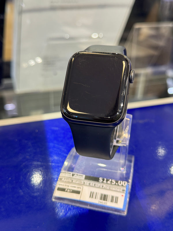 Smartwatch with a black band on a blue surface