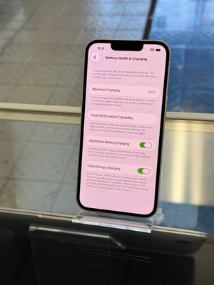 Smartphone displaying a charging app on a metallic surface