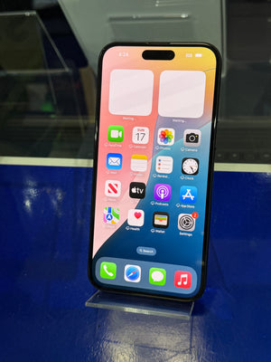 Smartphone with app icons displayed on a blue surface