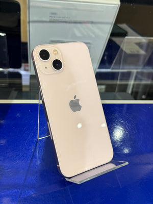 Silver iPhone with Apple logo on a blue surface