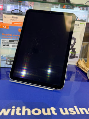 Tablet on a blue surface with blurred background