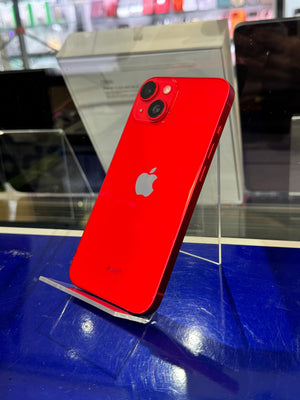 Red smartphone with Apple logo on a blue surface