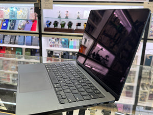 Laptop on display in a store with shelves in the background