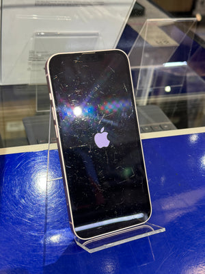 Smartphone with a scratched screen on a stand against a blue surface
