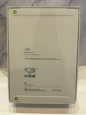 The back of a white rectangular product box on a white surface, with printed specifications and small green arrows near the top left and bottom left corners.