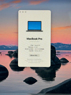 MacBook Pro specifications card with a scenic background of mountains and water.