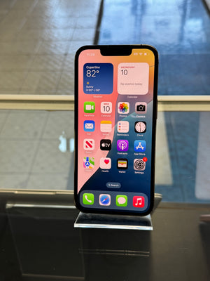 Smartphone with app icons displayed on a metallic surface
