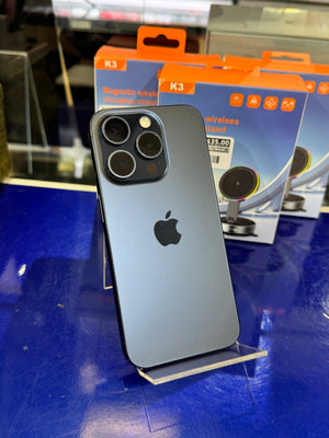 Black smartphone with Apple logo on a blue surface