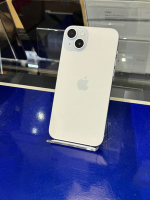 White Apple smartphone on a stand with a blue surface and reflective background