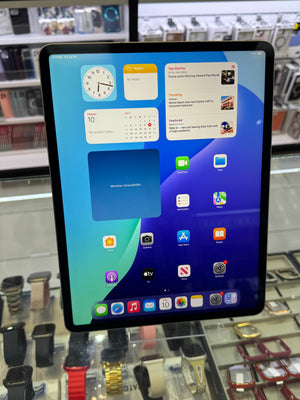 The home screen on an Apple iPad showing various apps