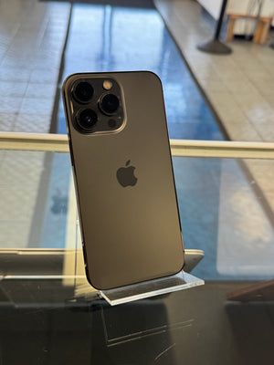 Black smartphone with Apple logo on a reflective surface