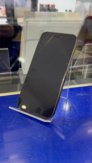 Smartphone on a stand with a blue surface and blurred background