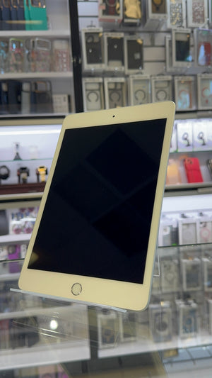 White tablet with a black screen on a shelf in a store
