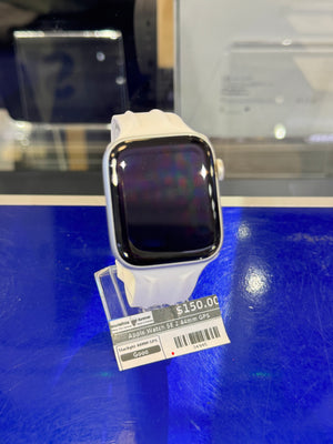 Smartwatch with a price tag on a blue surface