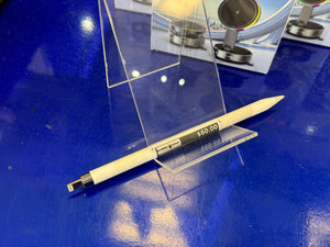 Pen with price tag on a blue surface