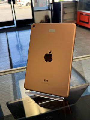 Gold iPad on a stand with blurred background