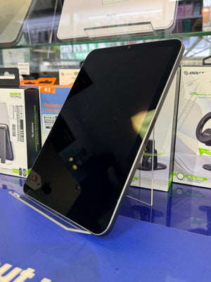 Tablet on display with electronic components in the background