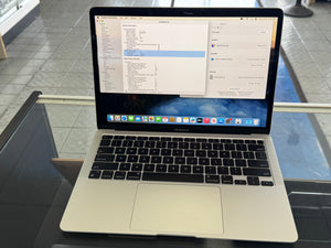 Laptop on a glass table with a blurred background