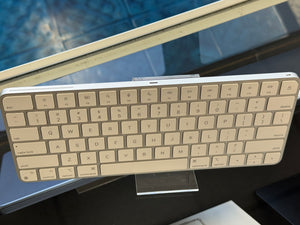 Wireless keyboard on a stand with a blurred background