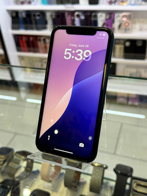 Smartphone on a display stand with a blurred store background