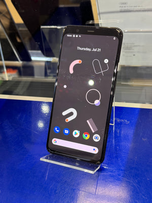Smartphone on a stand with a blue surface and reflective background