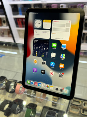 Tablet with app icons displayed in a store setting