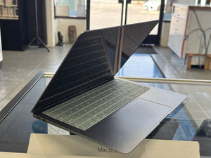Open laptop on a glass table
