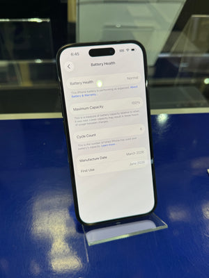Smartphone displaying a screen with text on a reflective surface