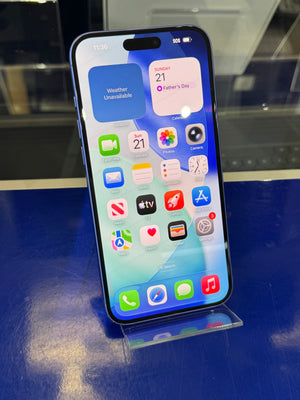 Smartphone with app icons displayed on a reflective surface