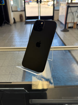 Black smartphone with Apple logo on a reflective surface