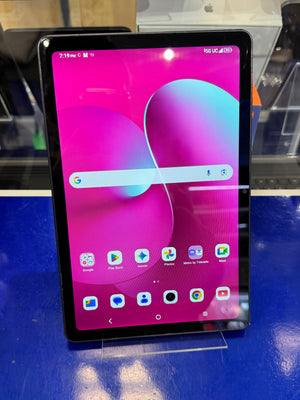 Tablet with a colorful display on a stand against a blue background