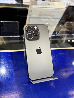 Silver iPhone 12 Pro Max on a stand with a blurred background