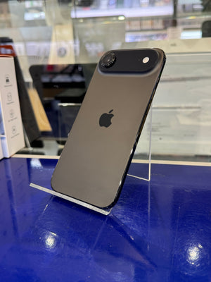 Black smartphone with Apple logo on a blue surface