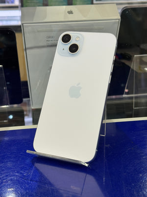 White smartphone with Apple logo on a blue surface
