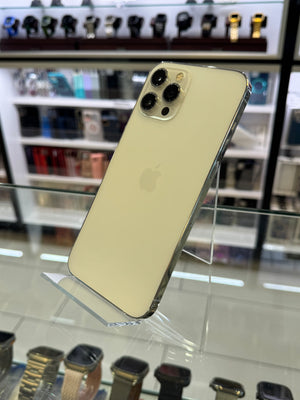Gold smartphone on a stand with blurred background