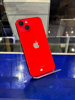 Red Apple smartphone on display with a blue and clear background