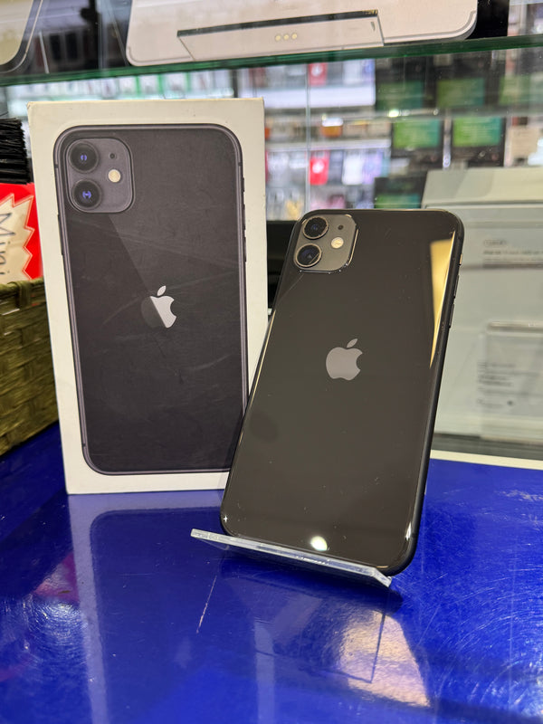 Black iPhone 11 on a stand with its box in the background