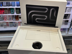 White electronic device with a black interior component on a shelf.