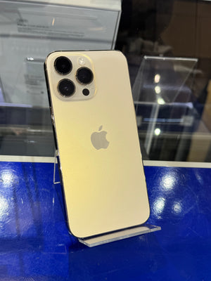 Gold iPhone with Apple logo on a blue surface