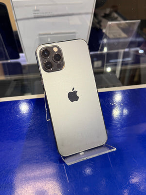 Silver iPhone with Apple logo on a blue surface