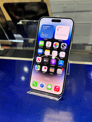 Smartphone with app icons on a blue surface