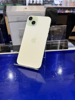 Green smartphone on a blue surface with blurred background