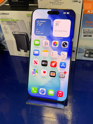 Smartphone with app icons displayed on a blue surface