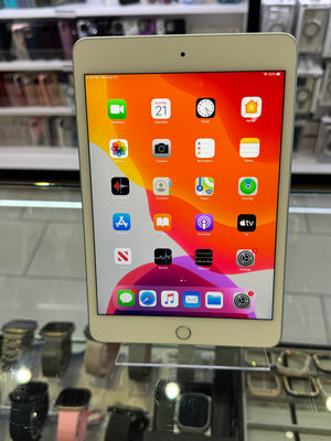 Tablet with app icons on a display stand in a store setting