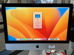 Apple iMac with colorful display and Apple logo