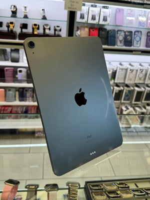 Back view of a smartphone with Apple logo on a reflective surface