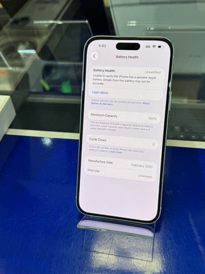 Smartphone displaying a screen with text on a reflective surface