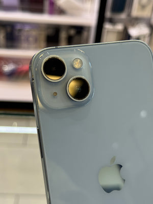 Close-up of a smartphone's camera module with Apple logo on a blurred background