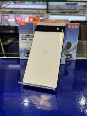 White smartphone on display with a blue background